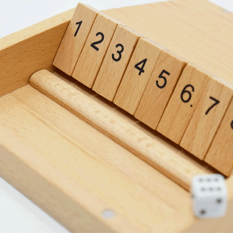 Animated gif of dice being rolled in a Shut the Box game by Velocity Promotions and tiles being flipped down during a player's turn.