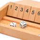 Detail close-up of an open Shut The Box Wooden Dice Game showing unflipped numbered tiles and two mini dice